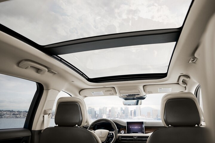 The available panoramic Vista Roof® is seen from inside a 2026 Lincoln Corsair