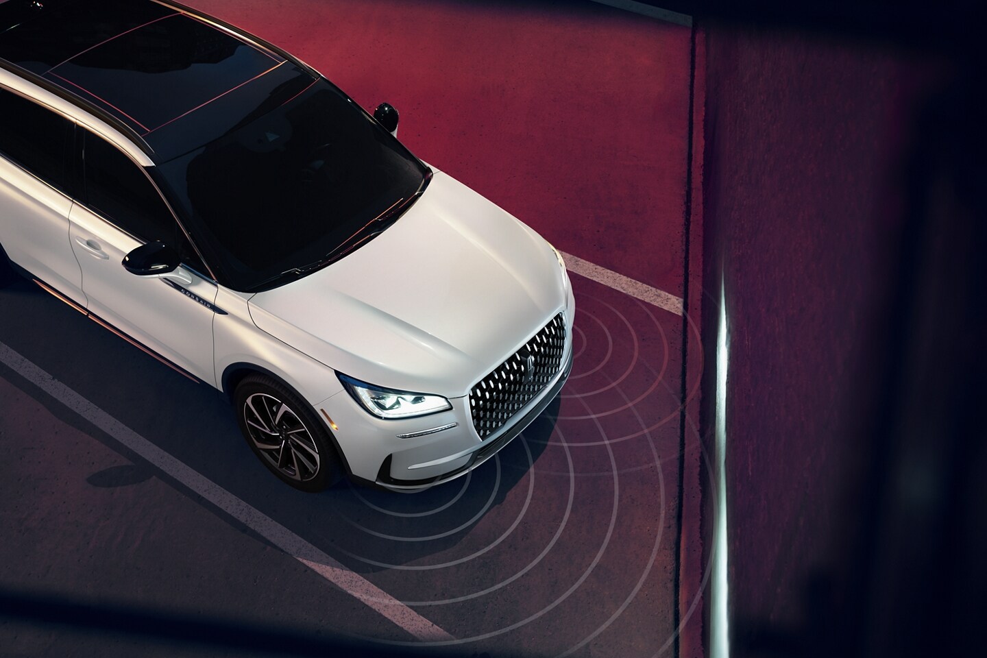 Simulated sensing waves emit from a 2026 Lincoln Corsair Reserve to demonstrate Pre-Collision Assist