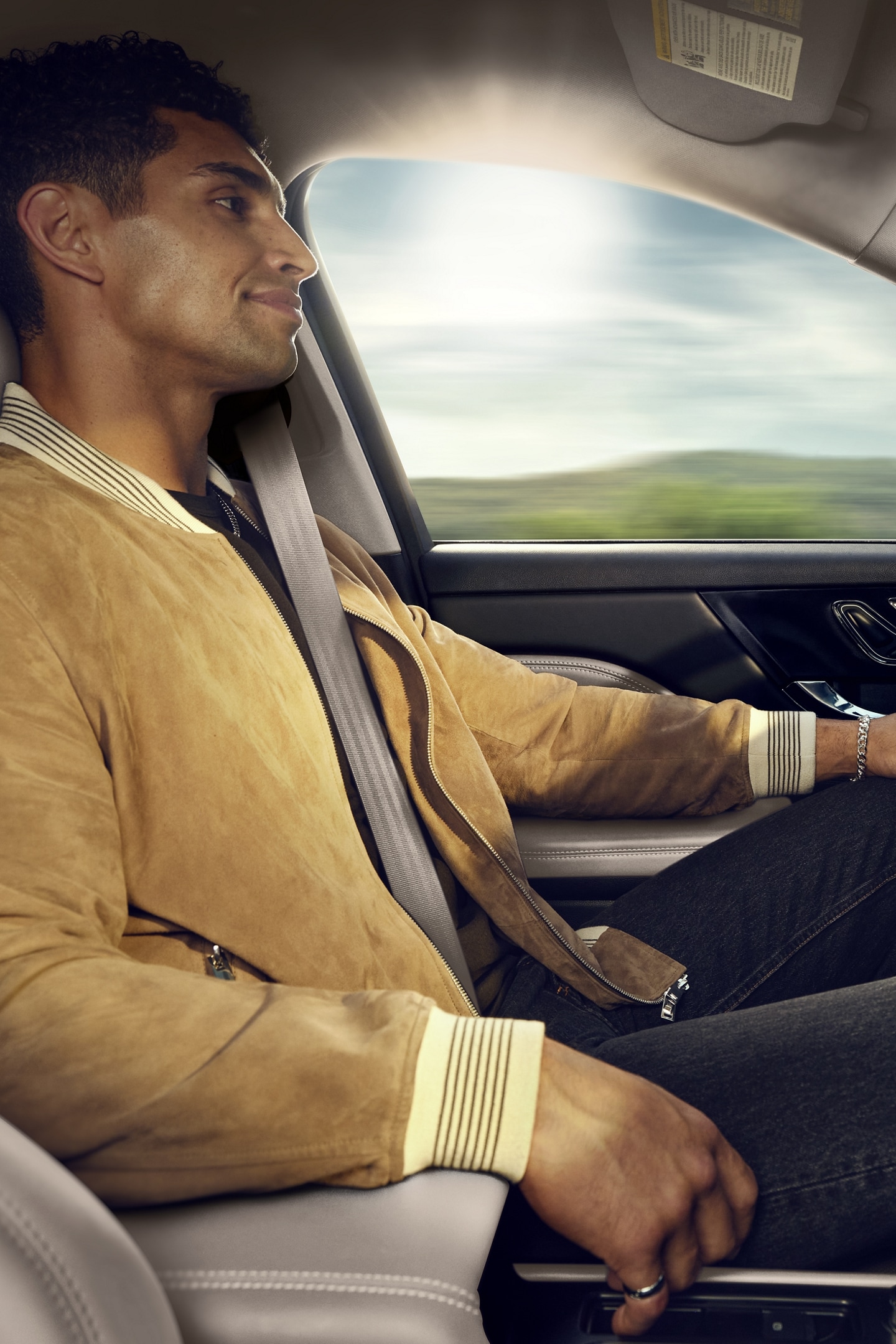 A driver enjoys using Lincoln BlueCruise hands-free restricted access divided highway driving