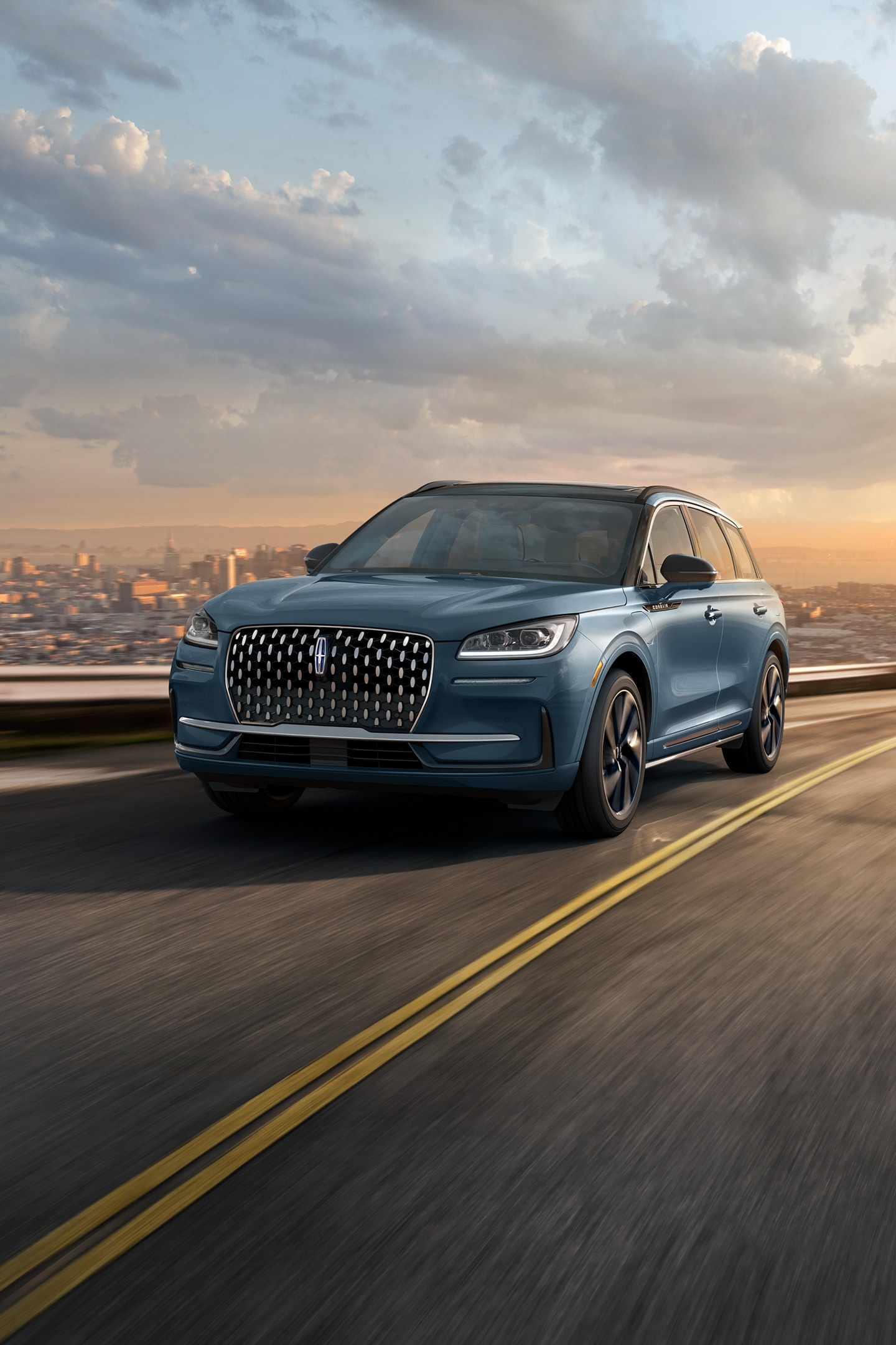 The stylish grille, unique to the 2026 Lincoln Corsair Grand Touring Plug-in Hybrid, glistens in the sunlight