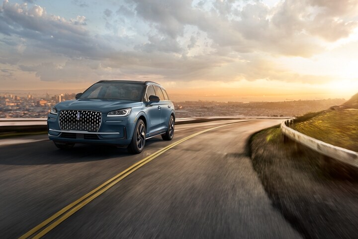 The stylish grille, unique to the 2026 Lincoln Corsair Grand Touring Plug-in Hybrid, glistens in the sunlight