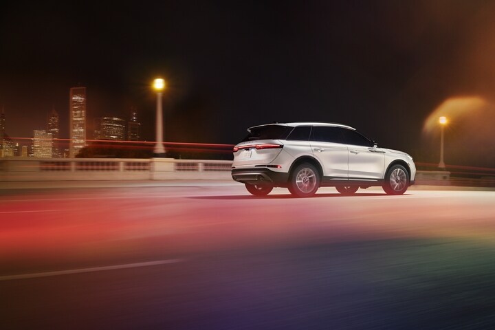 A 2026 Lincoln Corsair Reserve model is being driven on a highway at night