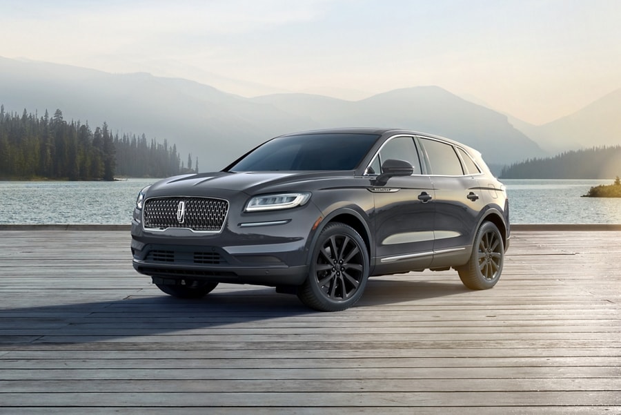 A 2023 Lincoln Nautilus SUV is shown with sunlight accentuating the seamless design of the Monochromatic Package