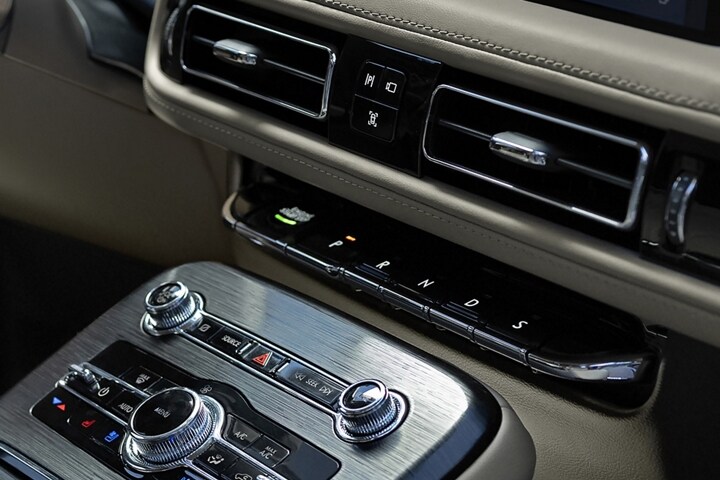 A close-up image of the push button shifter of the 2023 Lincoln Nautilus SUV