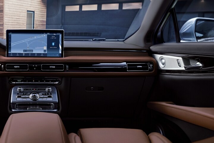 Available real open pore wood is shown in the interior of a 2023 Lincoln Nautilus SUV