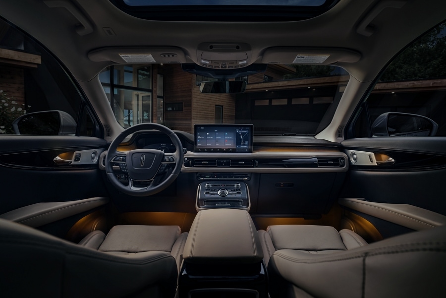 The orange ambient lighting inside a 2023 Lincoln Nautilus SUV in Sandstone Interior creates a soft glow and relaxing mood