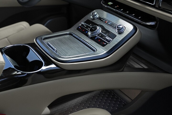 The front cabin of a 2023 Lincoln Nautilus SUV in the Sandstone interior