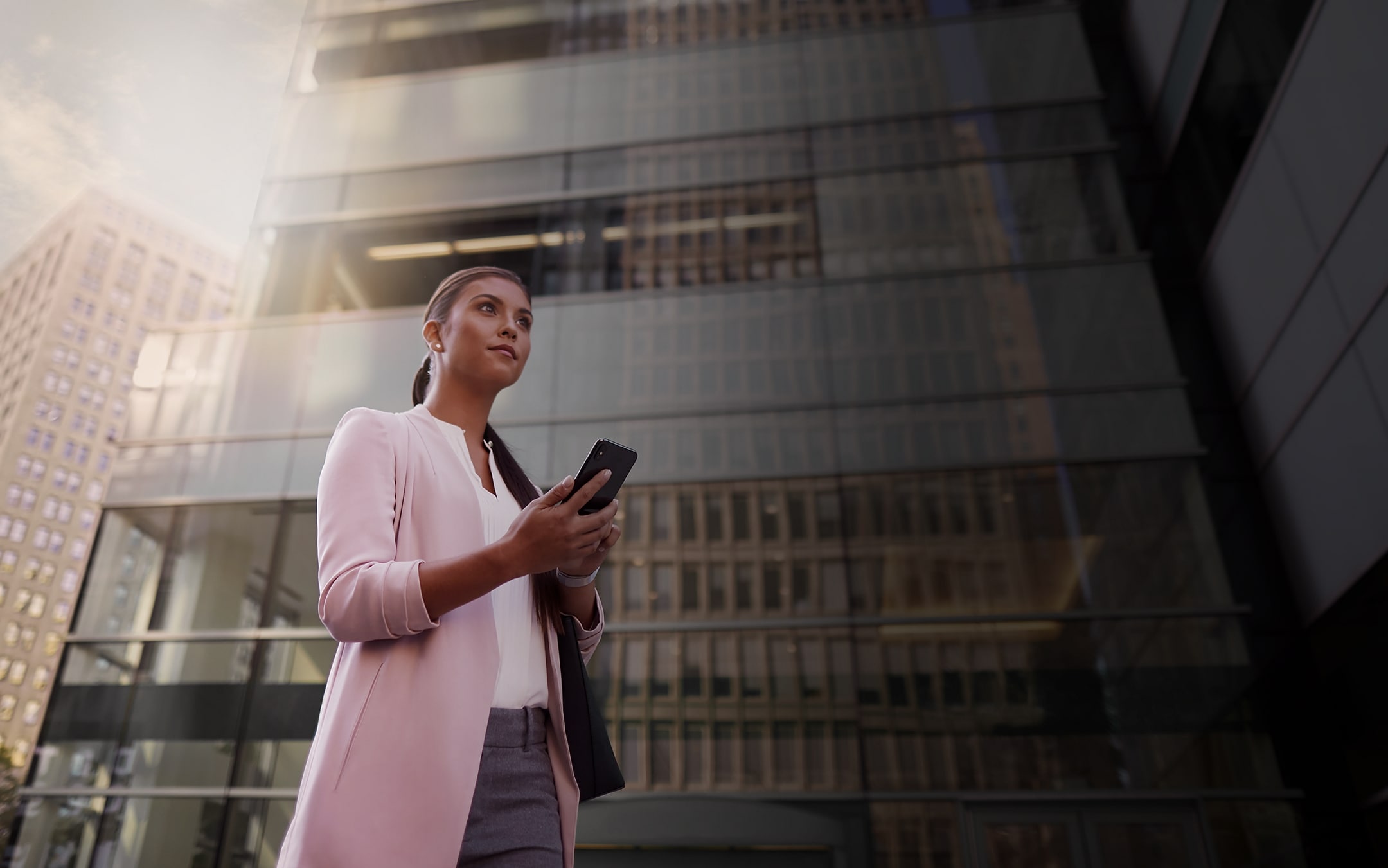 A woman interacts with the Lincoln Way™ App on her smartphone