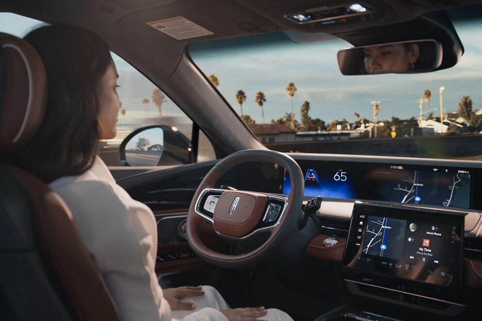 A driver of a 2025 Lincoln Nautilus SUV is shown using hands-free Lincoln  BlueCruise technology on a divided highway