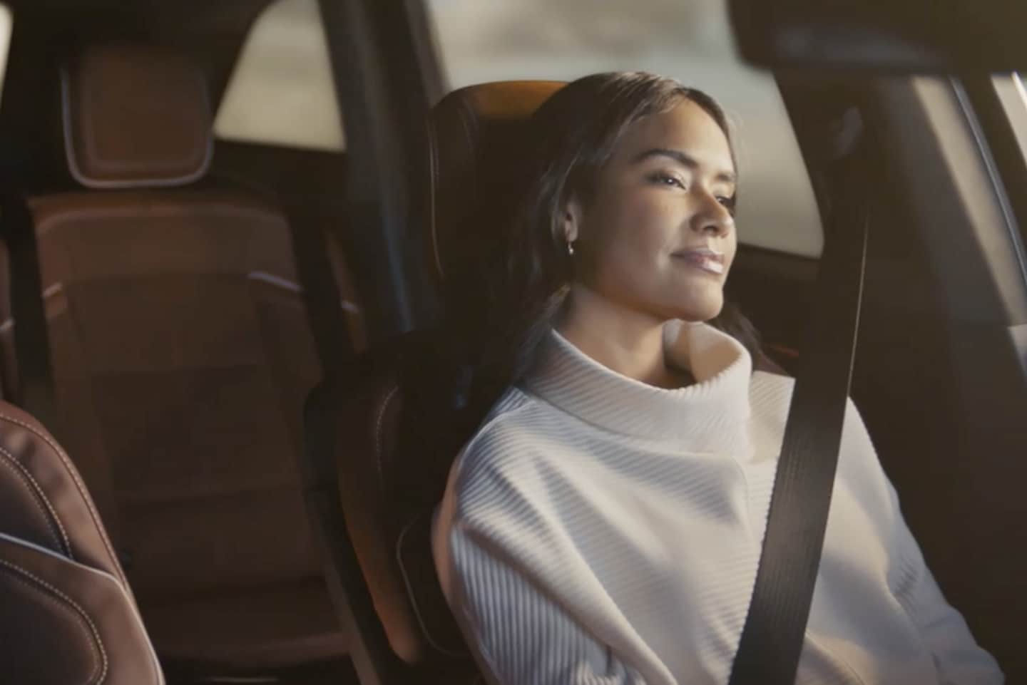 The driver of a parked 2025 Lincoln Black Label Nautilus SUV takes a relaxing moment
