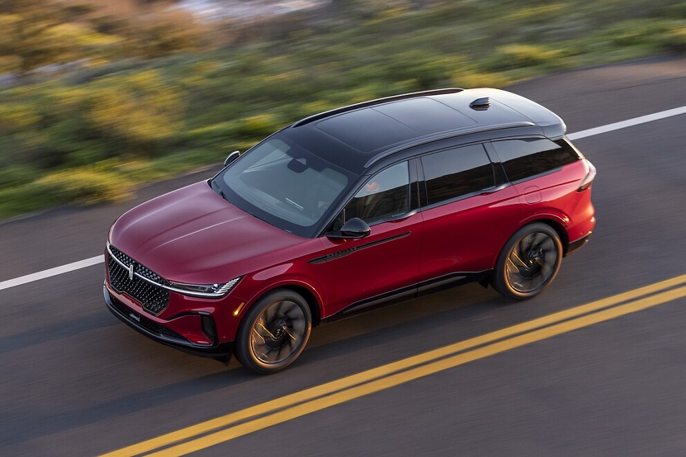 A 2025 Lincoln Nautilus SUV is being driven with the painted black roof showing prominently