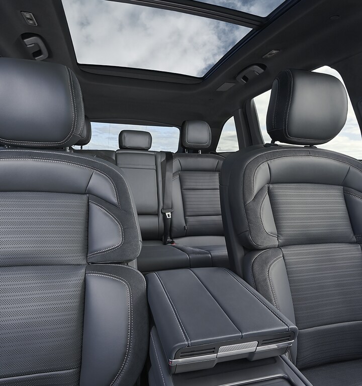 A spacious interior view of a 2025 Lincoln Nautilus SUV from the front row to the second row