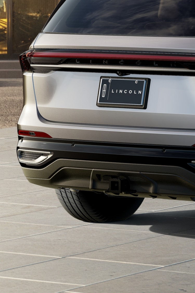 The Available Trailer Tow Class I Package is shown below the rear bumper of a 2025 Lincoln Nautilus SUV