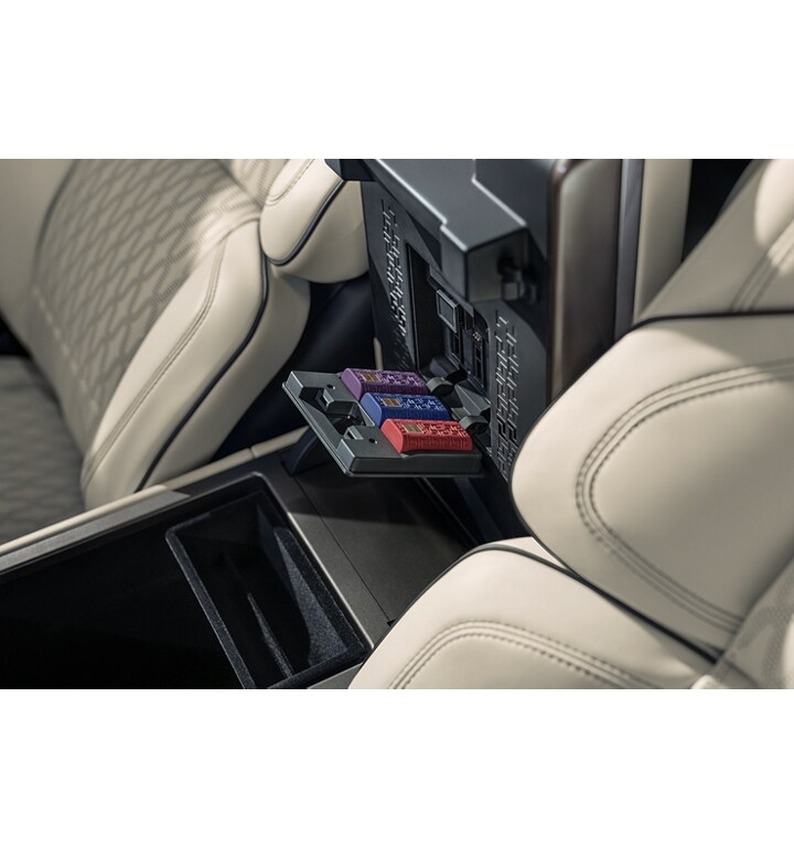 The centre console of a 2025 Lincoln Nautilus SUV is open to show scent cartridges in the diffuser