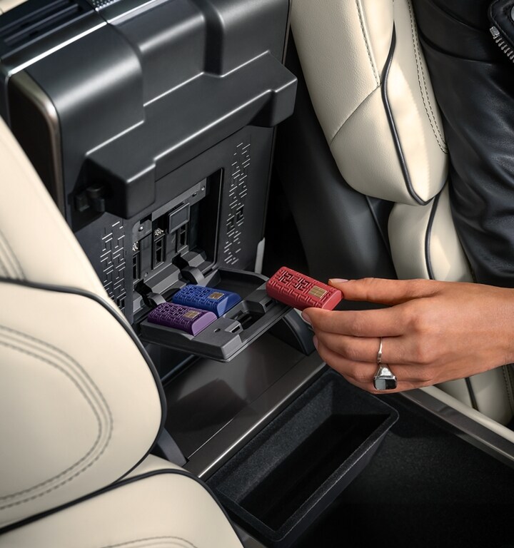 Digital Scent cartridges are shown inserted within the front armrest