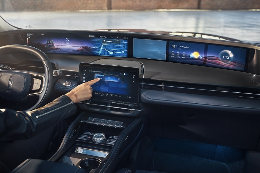 Turn-by-turn driving directions are shown on the panoramic display