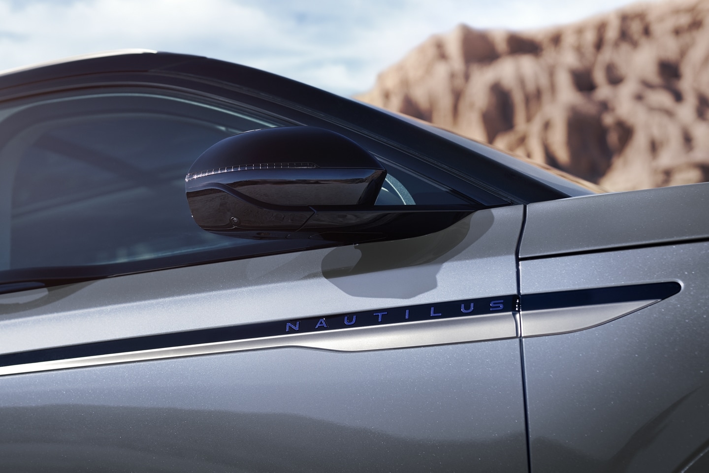 The sideview mirrors of a 2025 Lincoln Nautilus SUV are in the extended position