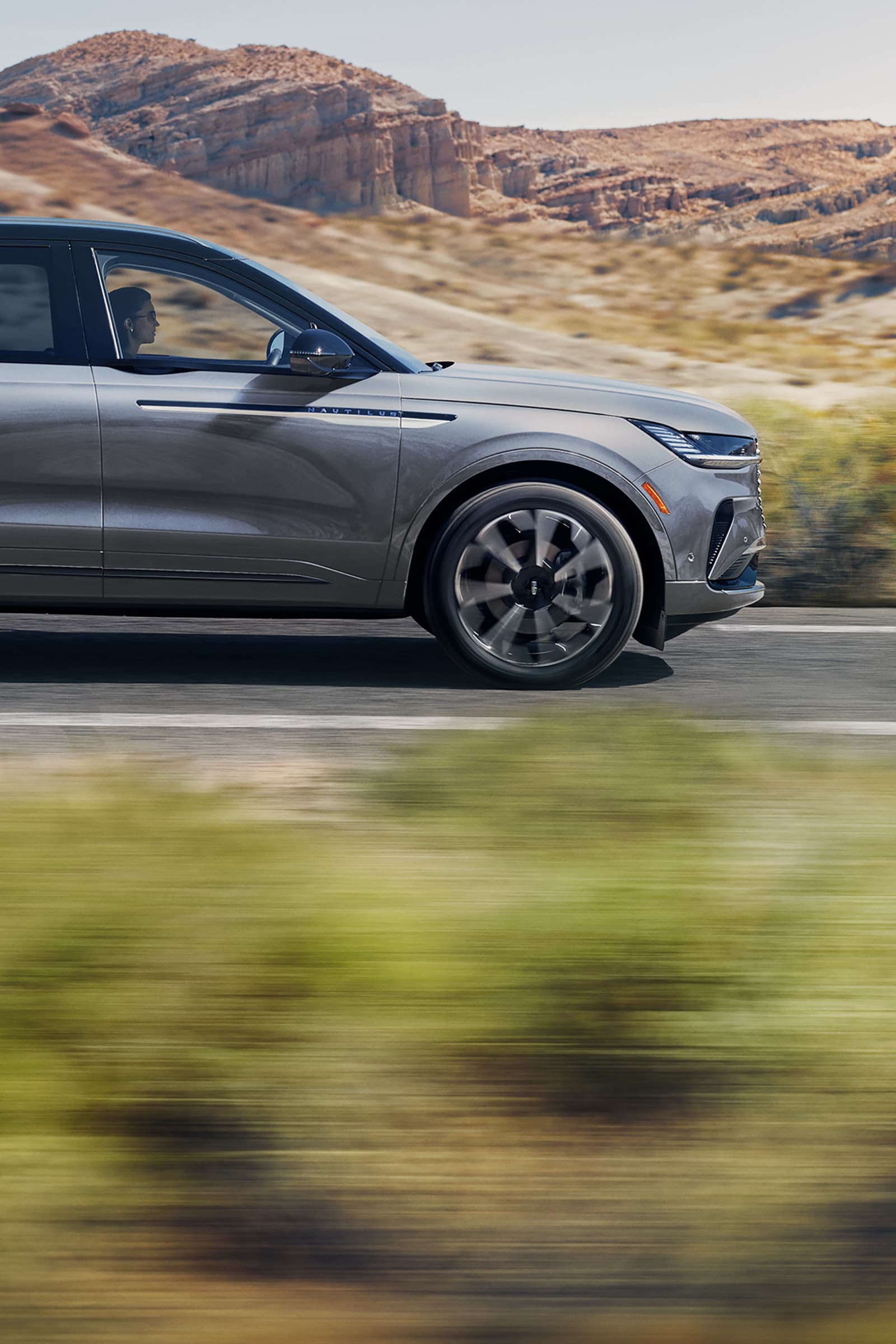 A 2025 Lincoln Nautilus SUV is in a desert-like setting