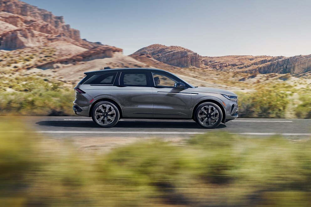 A 2025 Lincoln Nautilus Reserve model is being driven through a desert setting