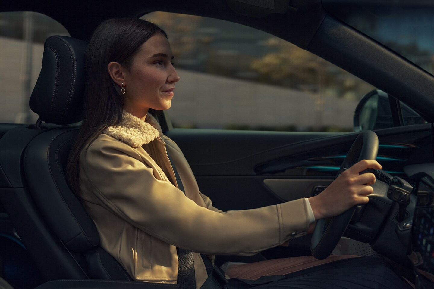 A woman is driving a 2026 Lincoln Nautilus