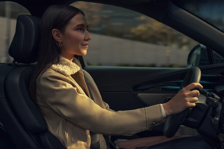 A woman is driving a 2026 Lincoln Nautilus