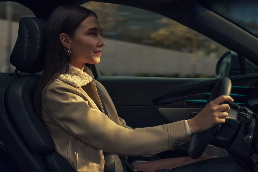 A woman is driving a 2026 Lincoln Nautilus