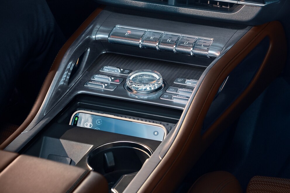 A mobile phone is being charged in media bin of a 2026 Lincoln Nautilus