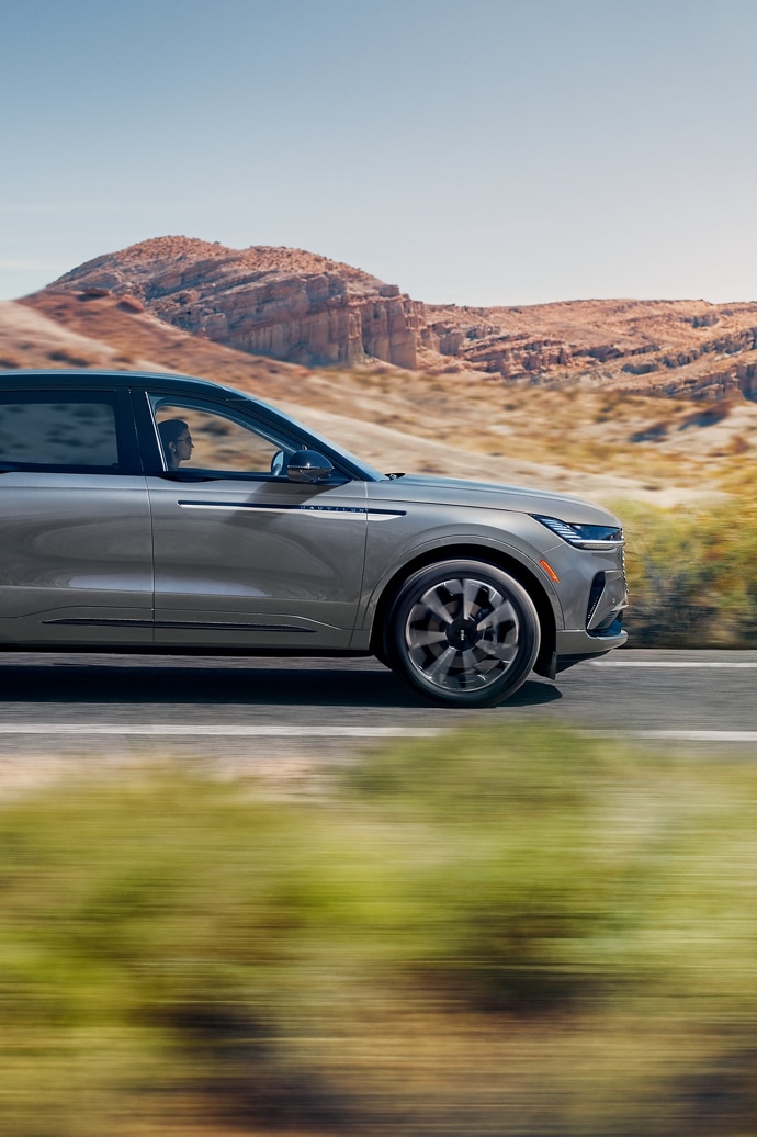 The 2026 Lincoln Nautilus is seen driving on a road