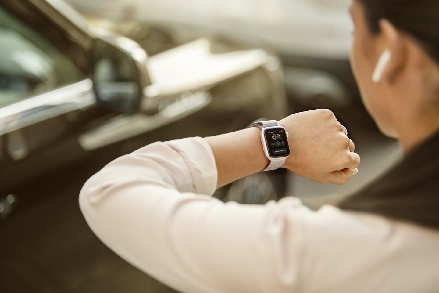A woman looking at her Smart Watch