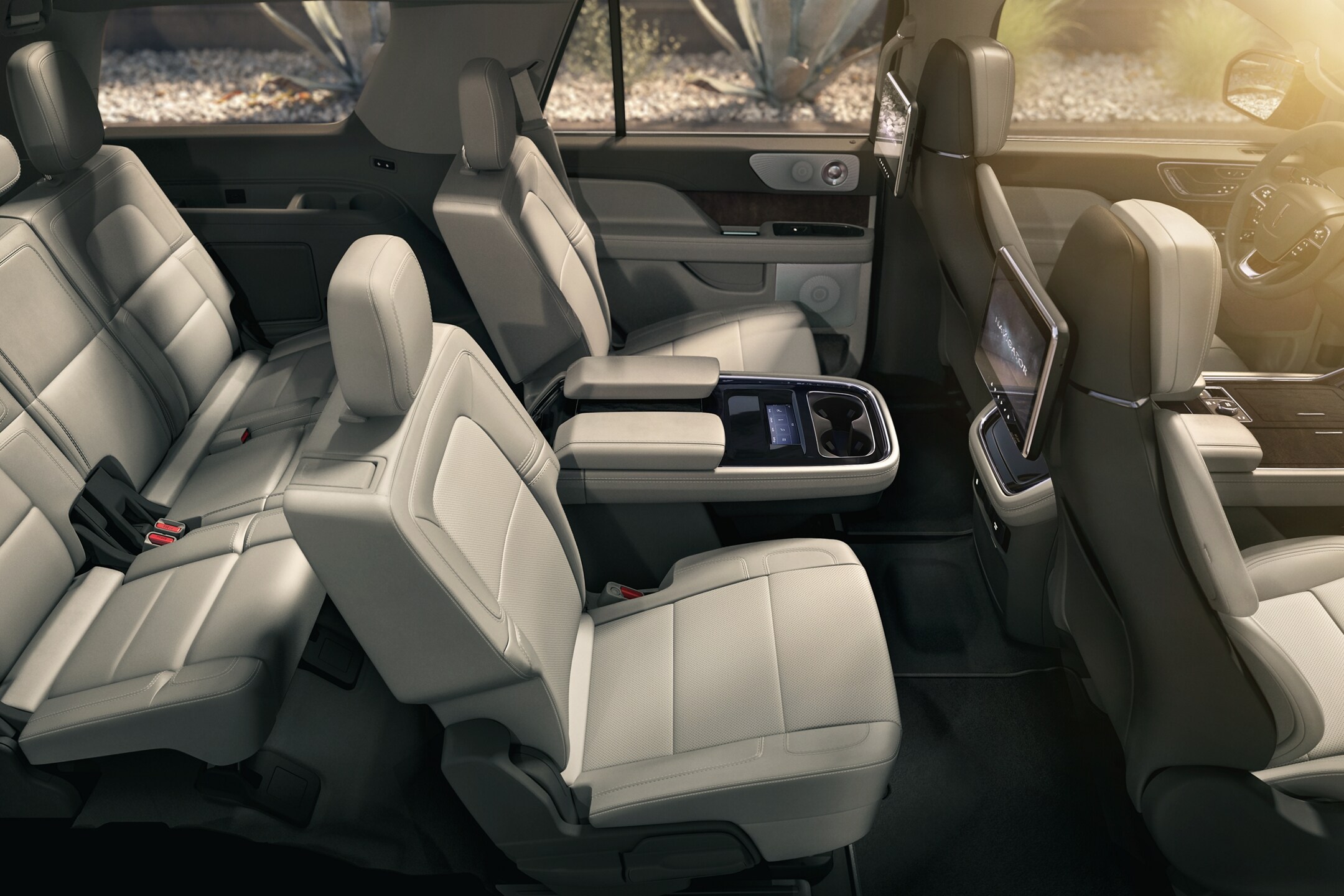 The spacious second and third rows of a 2024 Lincoln Black Label Navigator SUV show off comfort and style