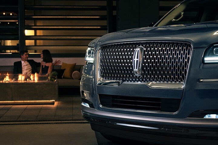 The grille design of a 2023 Lincoln Navigator SUV shows off the illuminated Lincoln star