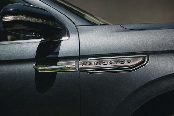 The nameplate badge on 2024 Lincoln Navigator SUV in Flight Blue show off geometric design