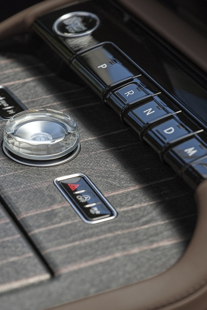Real wood appliqués of the centre console of 2025 Lincoln Black Label Navigator® SUV