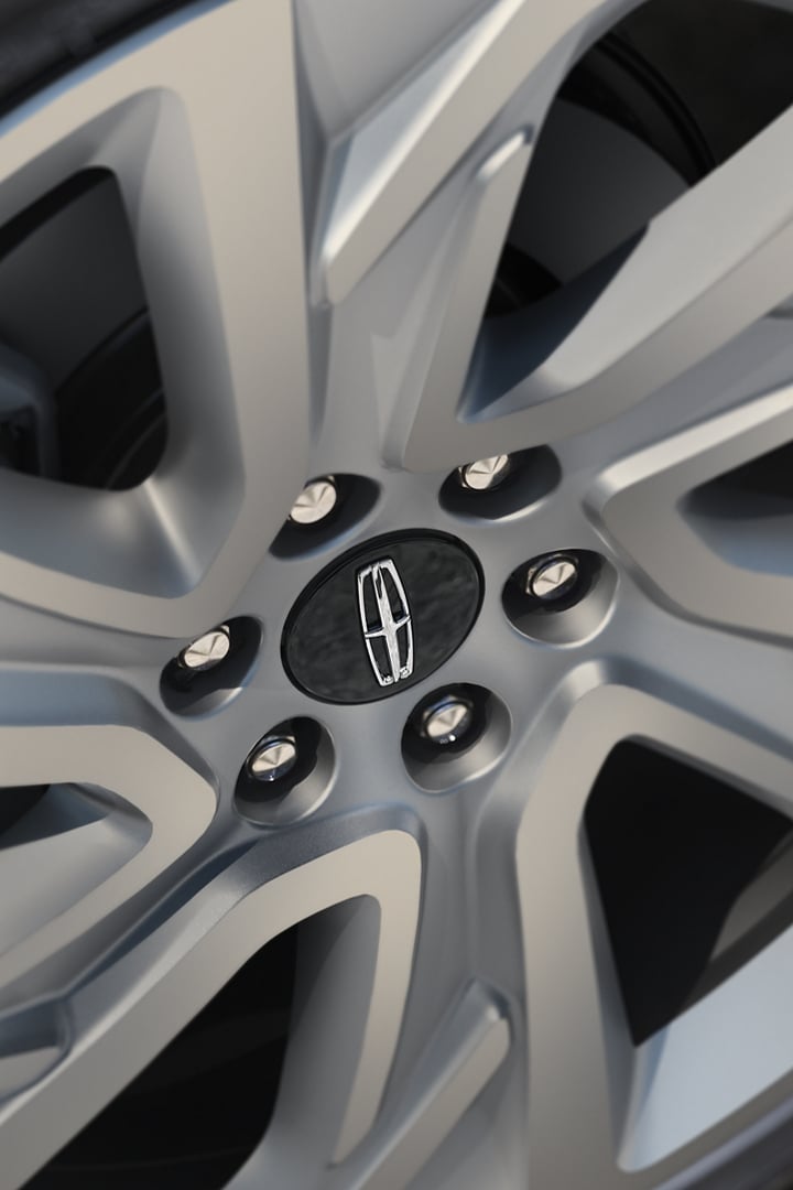 The available 24" Luster Nickel wheel on a 2025 Lincoln Black Label Navigator® SUV