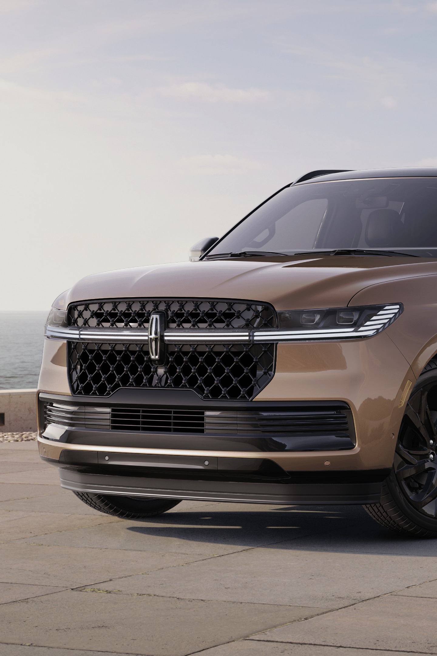 A 2025 Lincoln Navigator® SUV is parked at a scenic ocean-side overlook