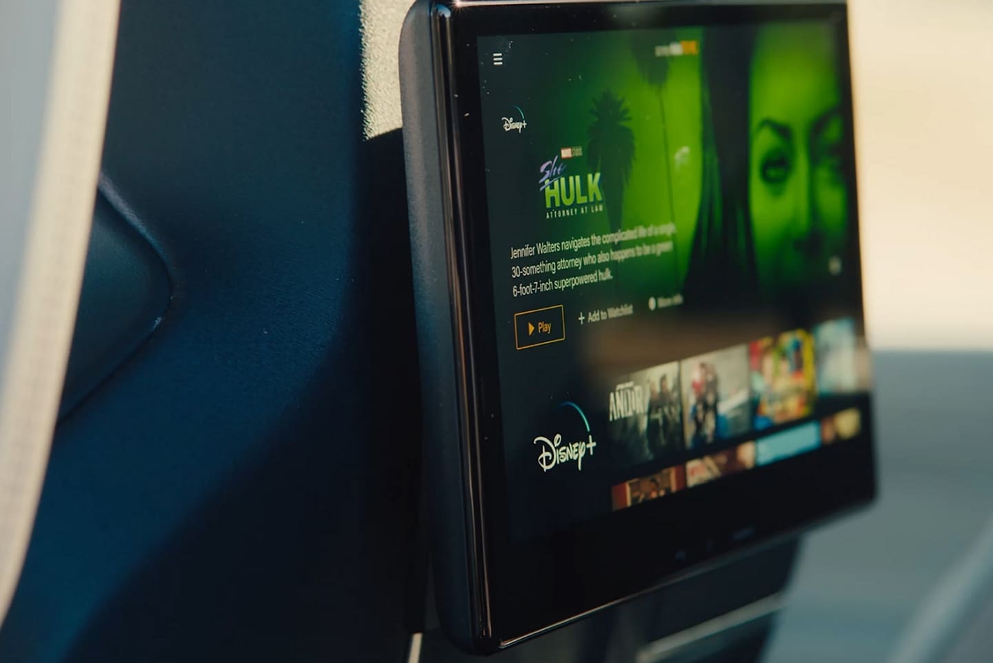 A screen attached to the back of the front row seats streams video content