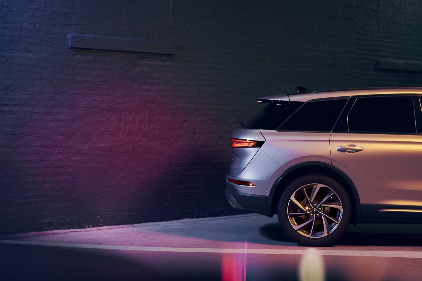 A 2023 Lincoln Corsair® SUV is shown in reverse close to a wall