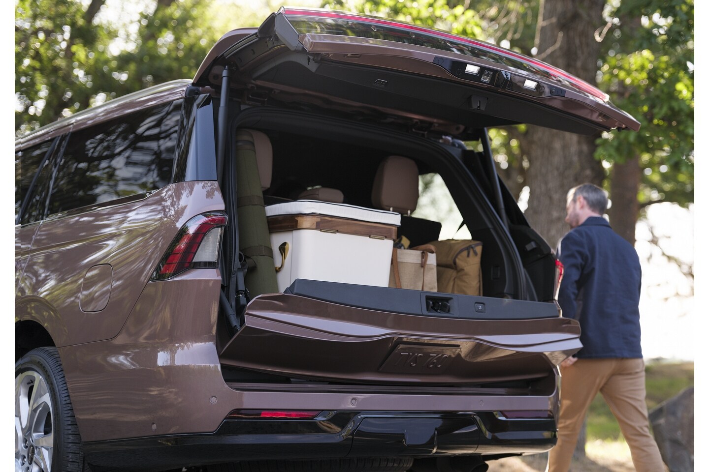 A man walking around his 2025 Lincoln Navigator.